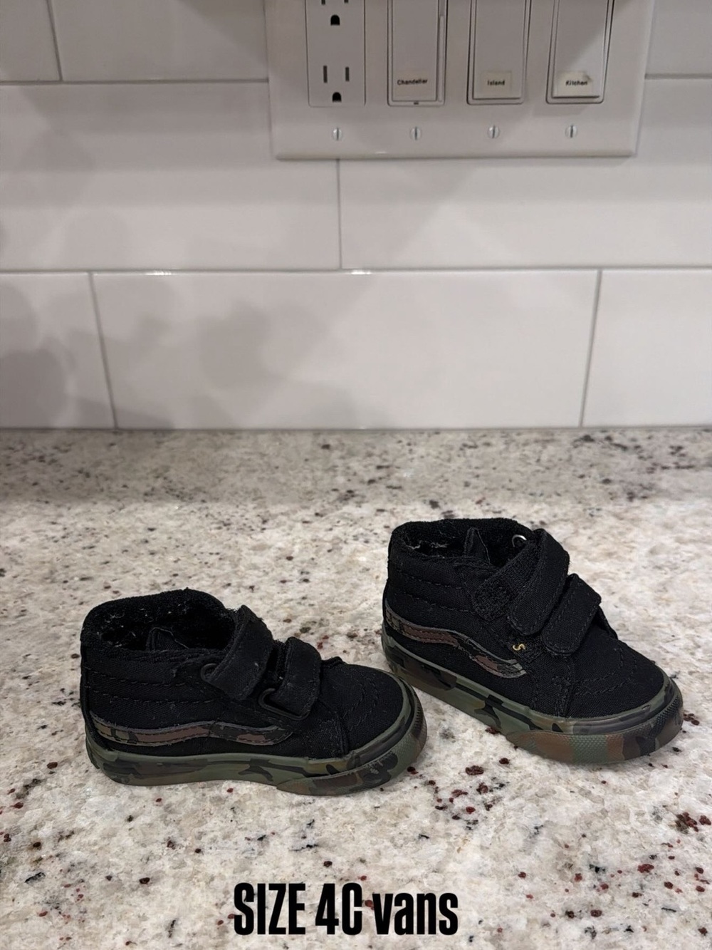 Vans Kids Black High-Top Sneakers with Camo Sole
